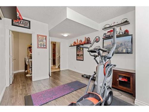 62 Crystal Green Way, Okotoks, AB - Indoor Photo Showing Gym Room