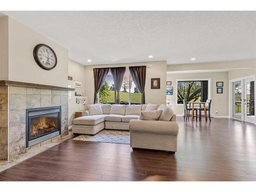 62 Crystal Green Way, Okotoks, AB - Indoor Photo Showing Living Room With Fireplace