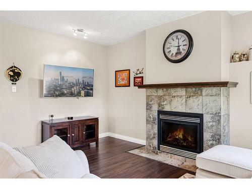 62 Crystal Green Way, Okotoks, AB - Indoor Photo Showing Living Room With Fireplace