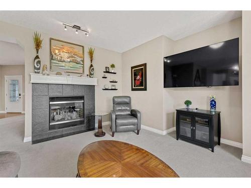 62 Crystal Green Way, Okotoks, AB - Indoor Photo Showing Living Room With Fireplace