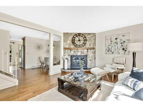 1004 Woodview Crescent Sw, Calgary, AB - Indoor Photo Showing Living Room With Fireplace