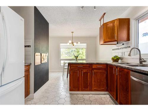 121 Sunmills Drive Se, Calgary, AB - Indoor Photo Showing Kitchen With Double Sink