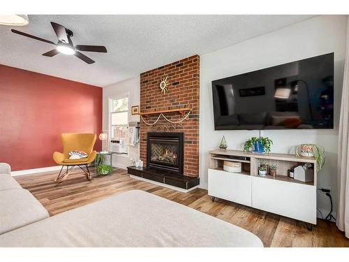 121 Sunmills Drive Se, Calgary, AB - Indoor Photo Showing Living Room With Fireplace