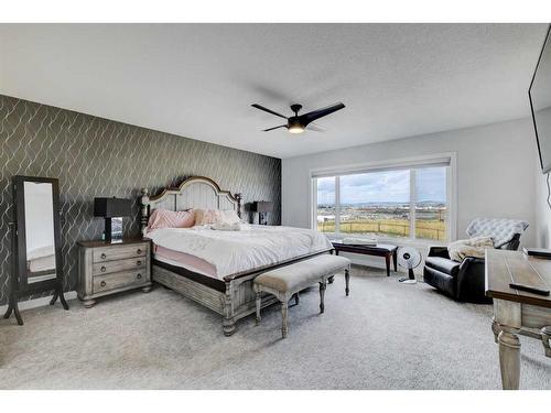 235 Precedence Hill, Cochrane, AB - Indoor Photo Showing Bedroom