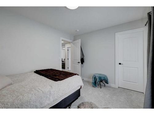 235 Precedence Hill, Cochrane, AB - Indoor Photo Showing Bedroom