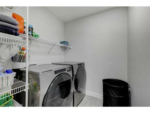 235 Precedence Hill, Cochrane, AB - Indoor Photo Showing Laundry Room