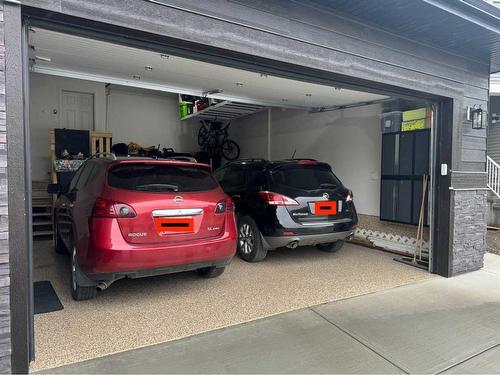 235 Precedence Hill, Cochrane, AB - Indoor Photo Showing Garage