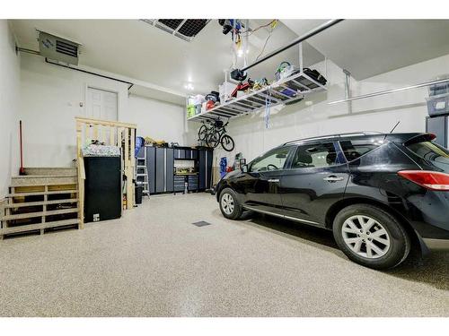 235 Precedence Hill, Cochrane, AB - Indoor Photo Showing Garage