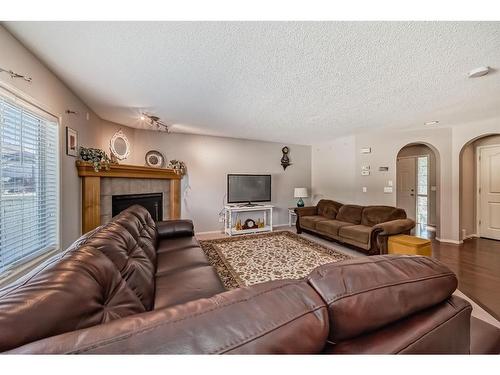 186 Everstone Drive Sw, Calgary, AB - Indoor Photo Showing Living Room With Fireplace