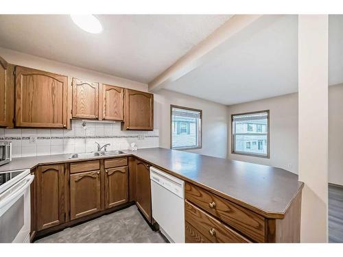 56 Country Hills Villas Nw, Calgary, AB - Indoor Photo Showing Kitchen With Double Sink