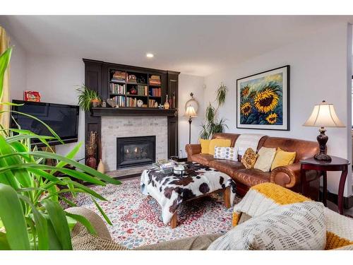 37 Lakeside Greens Close, Chestermere, AB - Indoor Photo Showing Living Room With Fireplace