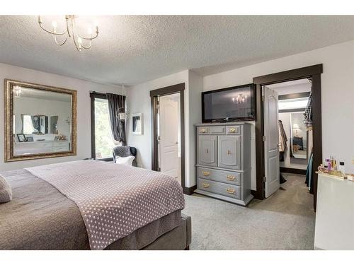 37 Lakeside Greens Close, Chestermere, AB - Indoor Photo Showing Bedroom