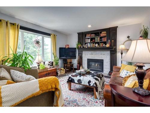 37 Lakeside Greens Close, Chestermere, AB - Indoor Photo Showing Living Room With Fireplace