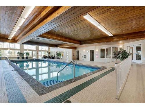 120-6868 Sierra Morena Boulevard Sw, Calgary, AB - Indoor Photo Showing Other Room With In Ground Pool