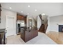 91 Panton Road Nw, Calgary, AB  - Indoor Photo Showing Kitchen With Fireplace 