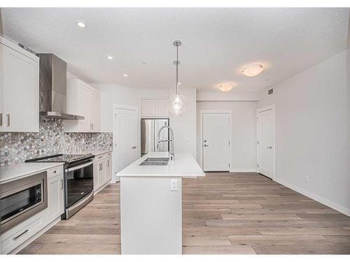 109-500 Auburn  Meadows Common Se, Calgary, AB - Indoor Photo Showing Kitchen With Double Sink With Upgraded Kitchen