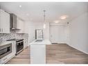 109-500 Auburn  Meadows Common Se, Calgary, AB  - Indoor Photo Showing Kitchen With Double Sink With Upgraded Kitchen 