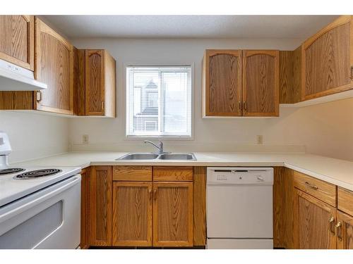 1002 Signal Hill Green Sw, Calgary, AB - Indoor Photo Showing Kitchen With Double Sink