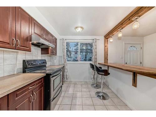 107-2211 19 Street Ne, Calgary, AB - Indoor Photo Showing Kitchen