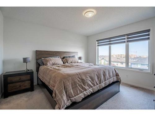 201 Hillcrest Drive Sw, Airdrie, AB - Indoor Photo Showing Bedroom