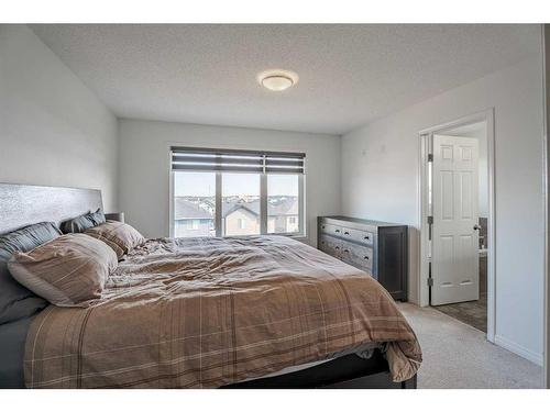 201 Hillcrest Drive Sw, Airdrie, AB - Indoor Photo Showing Bedroom