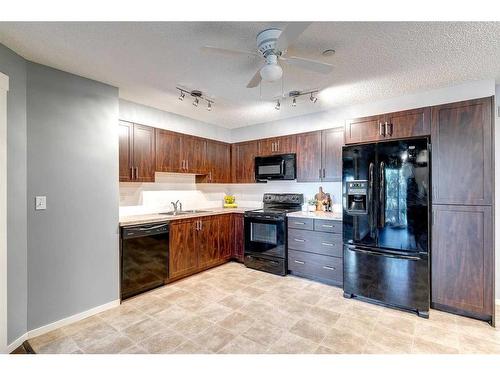 5211-279 Copperpond Common Se, Calgary, AB - Indoor Photo Showing Kitchen With Double Sink