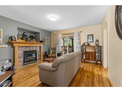 311 Carriage Lane Drive, Carstairs, AB - Indoor Photo Showing Living Room With Fireplace