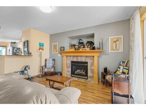 311 Carriage Lane Drive, Carstairs, AB - Indoor Photo Showing Living Room With Fireplace