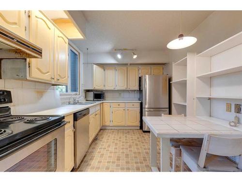 104-220 26 Avenue Sw, Calgary, AB - Indoor Photo Showing Kitchen With Stainless Steel Kitchen