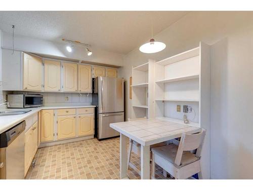 104-220 26 Avenue Sw, Calgary, AB - Indoor Photo Showing Kitchen With Stainless Steel Kitchen