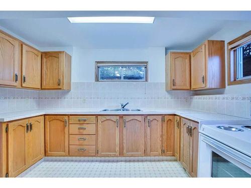 106 Sienna Hills Drive Sw, Calgary, AB - Indoor Photo Showing Kitchen With Double Sink