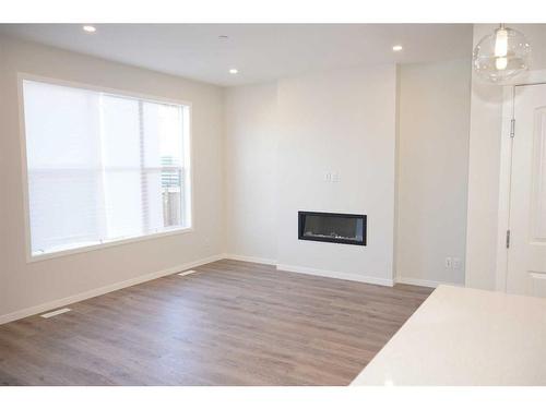 172 Hotchkiss Way Se, Calgary, AB - Indoor With Fireplace