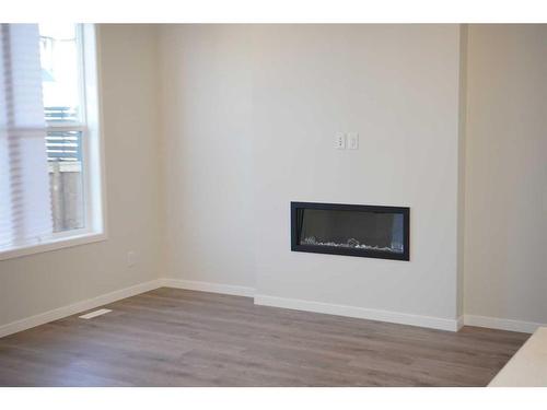 172 Hotchkiss Way Se, Calgary, AB - Indoor With Fireplace