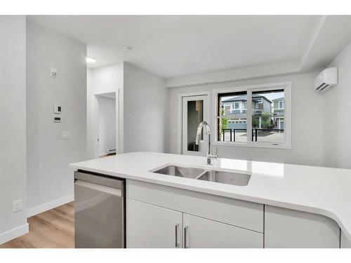 115-125 Wolf Hollow Crescent Se, Calgary, AB - Indoor Photo Showing Kitchen With Double Sink