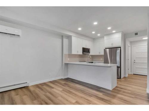 115-125 Wolf Hollow Crescent Se, Calgary, AB - Indoor Photo Showing Kitchen With Stainless Steel Kitchen