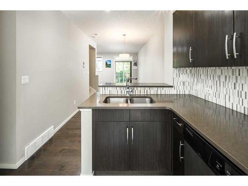 225 Ascot Circle Sw, Calgary, AB - Indoor Photo Showing Kitchen With Double Sink