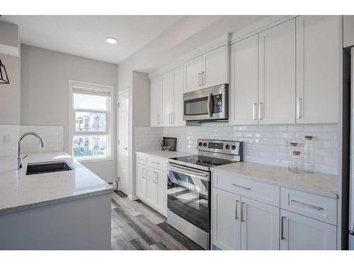 302-300 Harvest Hills Place Ne, Calgary, AB - Indoor Photo Showing Kitchen With Upgraded Kitchen