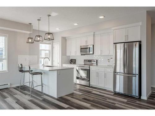 302-300 Harvest Hills Place Ne, Calgary, AB - Indoor Photo Showing Kitchen With Upgraded Kitchen