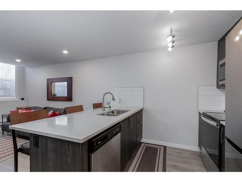 124 Cranbrook Square Se, Calgary, AB - Indoor Photo Showing Kitchen With Double Sink