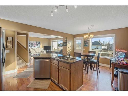 151 Somercrest Gardens Sw, Calgary, AB - Indoor Photo Showing Kitchen With Double Sink