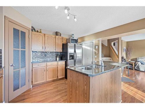 151 Somercrest Gardens Sw, Calgary, AB - Indoor Photo Showing Kitchen With Double Sink