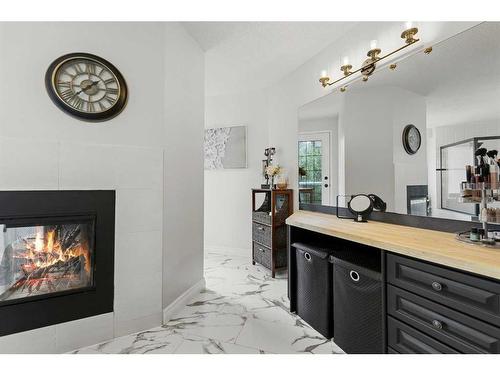 145 Candle Place Sw, Calgary, AB - Indoor Photo Showing Living Room With Fireplace