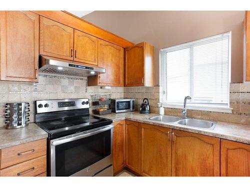 168 Citadel Close Nw, Calgary, AB - Indoor Photo Showing Kitchen With Double Sink