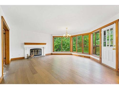 123 Coach Light Bay Sw, Calgary, AB - Indoor Photo Showing Living Room With Fireplace