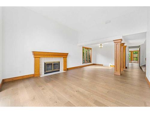 123 Coach Light Bay Sw, Calgary, AB - Indoor Photo Showing Living Room With Fireplace