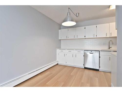 314-1602 11 Avenue Sw, Calgary, AB - Indoor Photo Showing Kitchen With Double Sink