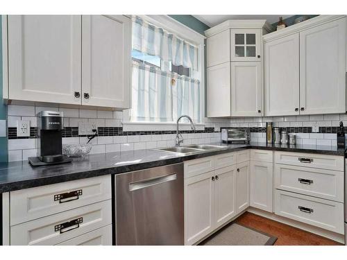 705 5 Street Sw, Sundre, AB - Indoor Photo Showing Kitchen With Double Sink