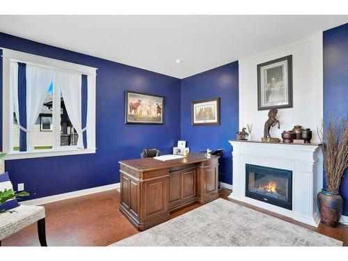 705 5 Street Sw, Sundre, AB - Indoor Photo Showing Living Room With Fireplace