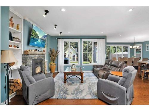 705 5 Street Sw, Sundre, AB - Indoor Photo Showing Living Room With Fireplace