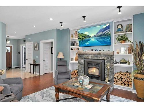 705 5 Street Sw, Sundre, AB - Indoor Photo Showing Living Room With Fireplace